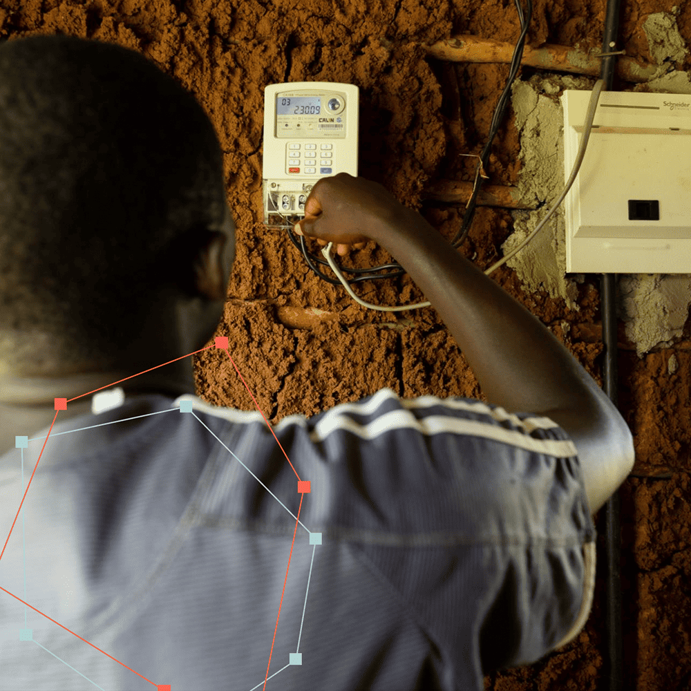 Image of man adjusting electrical wiring and meter
